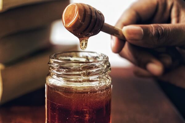 Eating a spoon of honey